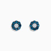 The Bella Bleu 14K White Gold Blue and White Diamond Flower Stud Earrings feature a cluster of white gems at the center, blue diamond adorned petals, and are displayed on a plain white background.