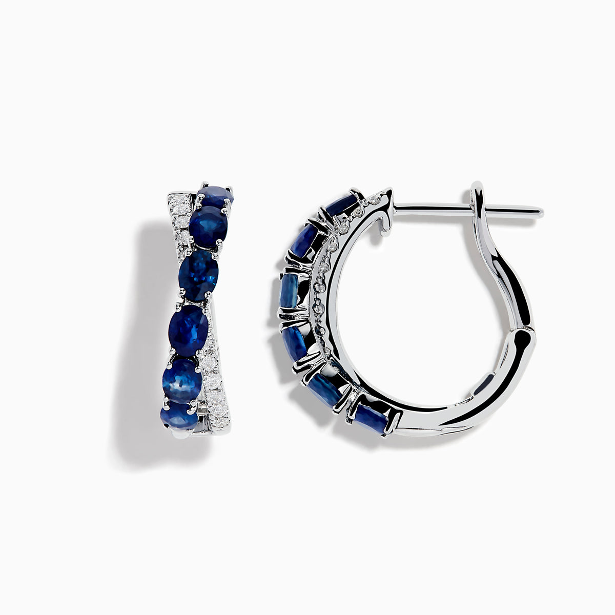 The Royale Bleu 14K White Gold Blue Sapphire and Diamond Hoop Earrings feature alternating oval blue sapphires and sparkling diamonds, all set in a white gold band and displayed against a white background.