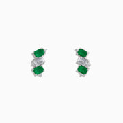 A pair of 14K white gold stud earrings featuring emerald gemstones, white sapphires, and diamonds.