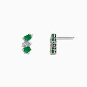 A pair of 14K white gold stud earrings featuring emerald gemstones, white sapphires, and diamonds.