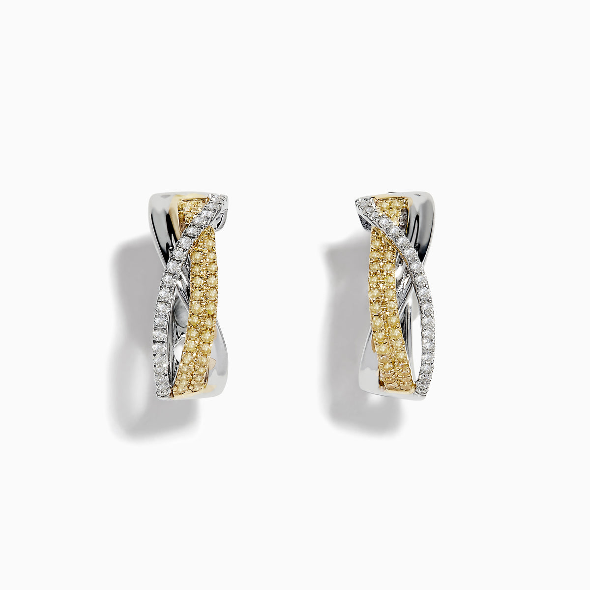 The Canare 14k Two Tone Yellow and White Diamond Hoop Earrings 5/8 feature intertwined yellow and white gold bands adorned with diamonds, beautifully displayed on a plain white background for a striking look.