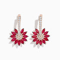 The 14K Rose Gold Ruby and Diamond Floral Huggie Earrings feature marquise-cut rubies as petals, accented by white diamonds and a vertical row of diamonds on elegant rose gold.