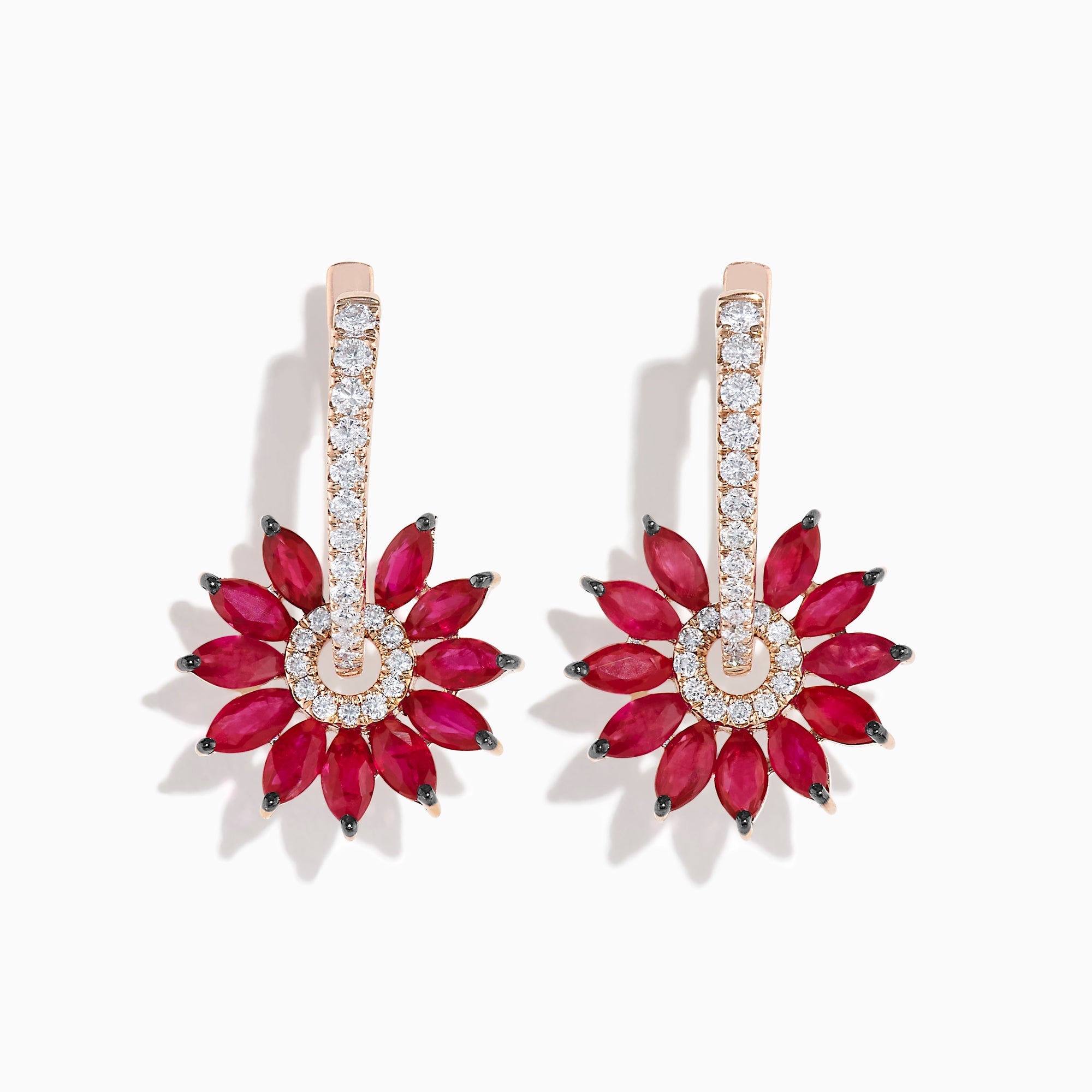 The 14K Rose Gold Ruby and Diamond Floral Huggie Earrings feature marquise-cut rubies as petals, accented by white diamonds and a vertical row of diamonds on elegant rose gold.