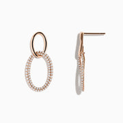 The Pave Rose 14K Rose Gold Diamond Interlock Earrings feature a small smooth oval linked to a larger diamond-encrusted oval, all elegantly crafted in 14K rose gold and displayed against a plain white background.