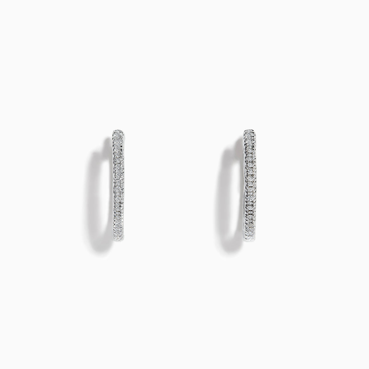 The Pave Classica 14k White Gold Diamond Hoop Earrings feature a thin, sparkling pave surface and are shown against a plain white background.