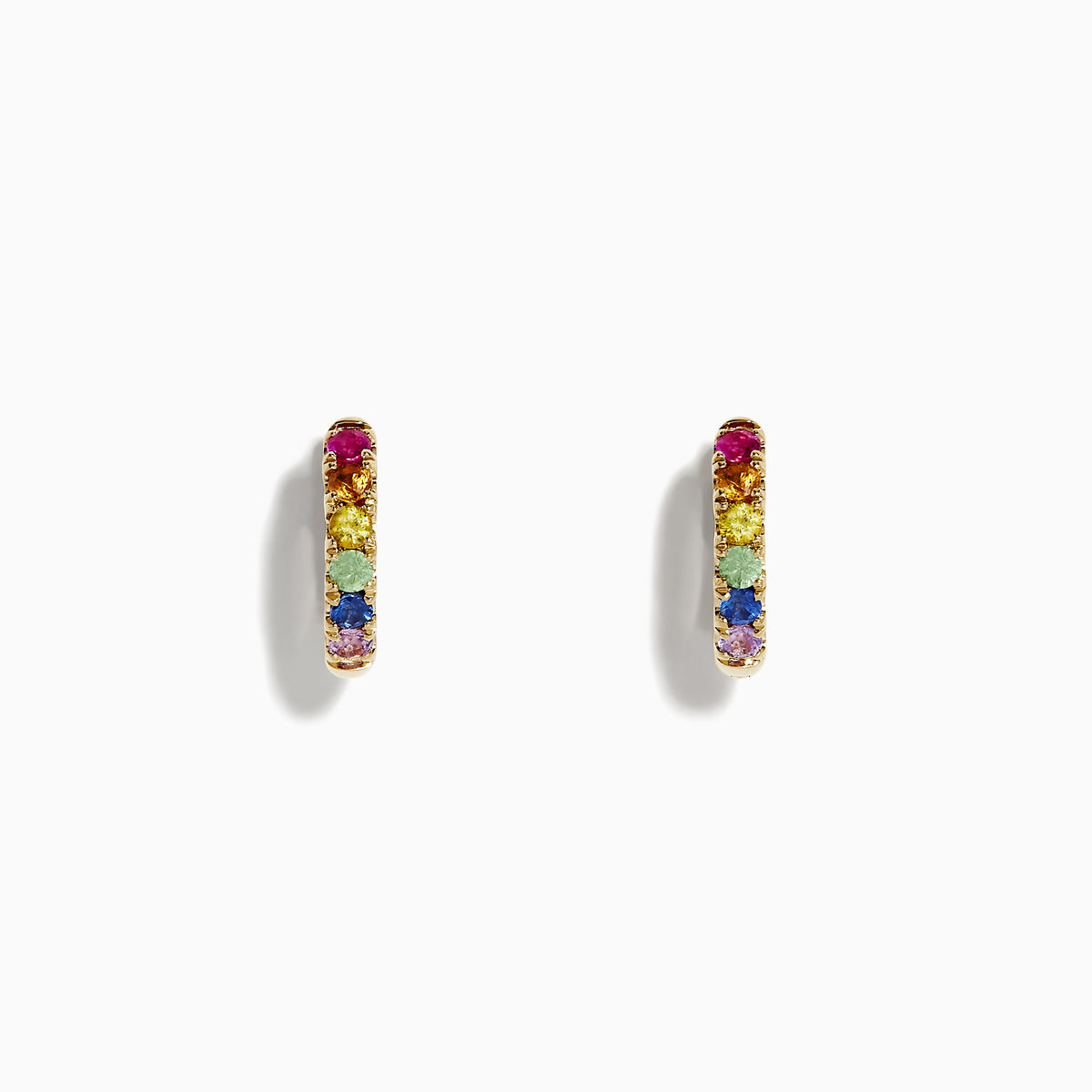 A pair of Watercolor 14k Gold Multi Sapphire Huggie Earrings featuring small gold hoops set with multicolored sapphires in a row, displayed on a plain white background.