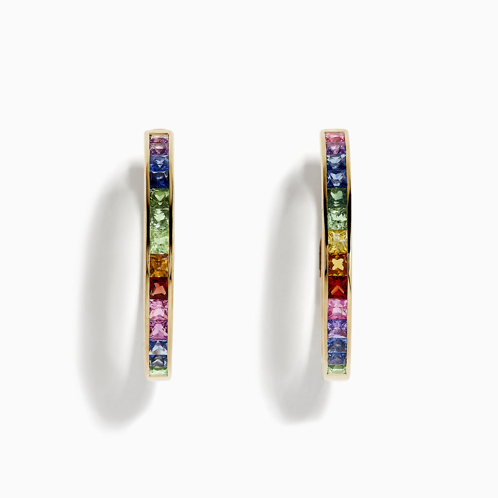 The Watercolor 14k Gold Princess Cut Multi Sapphire Hoop Earrings feature square-cut sapphires in a rainbow gradient of blue, green, yellow, orange, pink, and purple, shown against a white background.