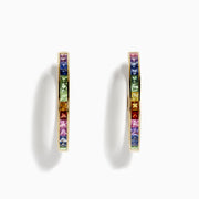 The Watercolor 14k Gold Princess Cut Multi Sapphire Hoop Earrings feature square-cut sapphires in a rainbow gradient of blue, green, yellow, orange, pink, and purple, shown against a white background.