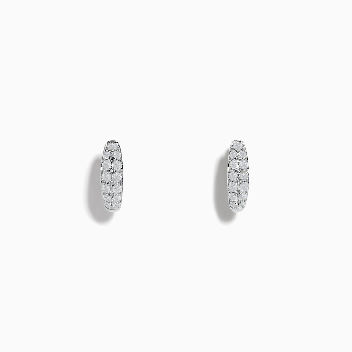 The Pave Classica 14k White Gold Diamond Huggie Earrings showcase elegant white gold design with sparkling diamonds, beautifully displayed against a plain white background.