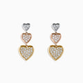 The Trio 14K Three Tone Gold Diamond Heart Drop Earrings 0.65 TCW showcase three stacked heart shapes in silver, rose gold, and yellow gold, each adorned with sparkling diamonds for a dazzling finish.