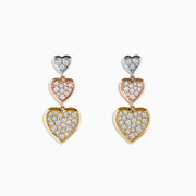 The Trio 14K Three Tone Gold Diamond Heart Drop Earrings 0.65 TCW showcase three stacked heart shapes in silver, rose gold, and yellow gold, each adorned with sparkling diamonds for a dazzling finish.