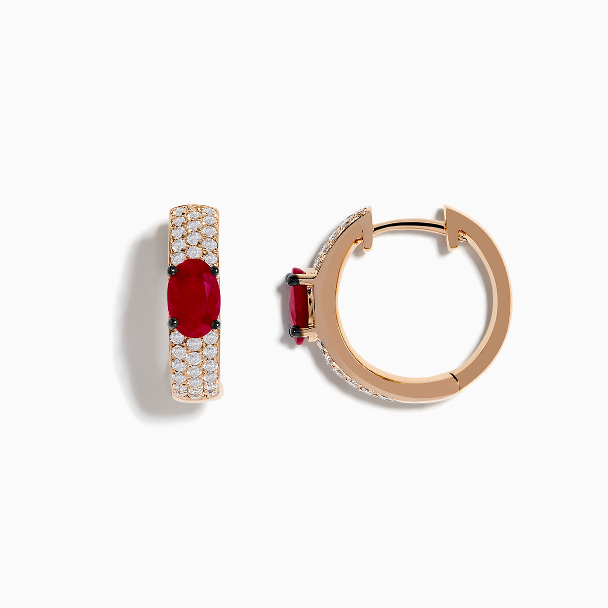 These 14K Rose Gold Ruby and Diamond Huggie Hoop Earrings feature a central oval ruby surrounded by rows of sparkling diamonds, creating a stunning shine against any background.
