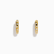The D'Oro 14K Yellow Gold Diamond Huggie Earrings each feature three round white diamonds set vertically and are displayed against a plain white background.