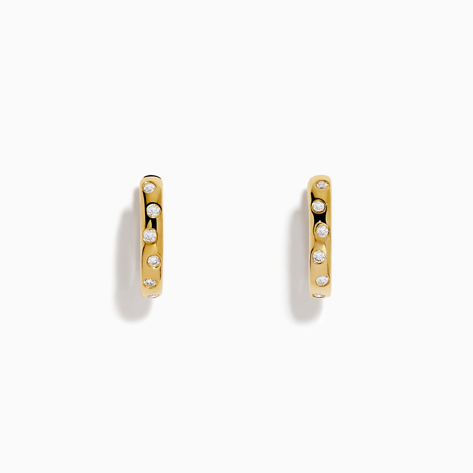The D'Oro 14K Yellow Gold Diamond Huggie Earrings each feature three round white diamonds set vertically and are displayed against a plain white background.