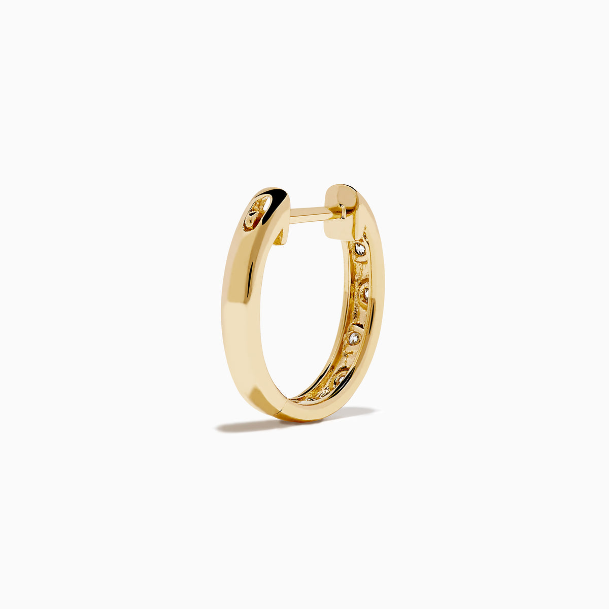 The D'Oro 14K Yellow Gold Diamond Huggie Earrings each feature three round white diamonds set vertically and are displayed against a plain white background.