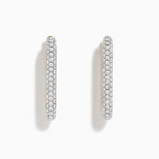 The 14K Two-Tone Gold Diamond Pavé Rectangle Hoop Earrings feature vertical, elongated hoops encrusted with sparkling pavé-set white diamonds, showcased against a plain white background.