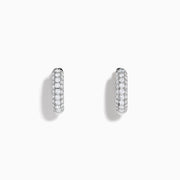 Introducing the 14K White Gold Diamond Three Row Pave Mini Hoop Earrings, featuring multiple rows of sparkling diamonds meticulously set in 14K white gold and elegantly presented against a plain white background.