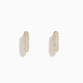 The 14K Yellow Gold Diamond Pavé Dome Mini Hoop Earrings feature rows of sparkling diamonds set in yellow gold, shown on a plain white background.