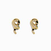The 14K Yellow Gold Black and White Diamond Snake Earrings, featuring green gemstones, are elegantly displayed on a white background.