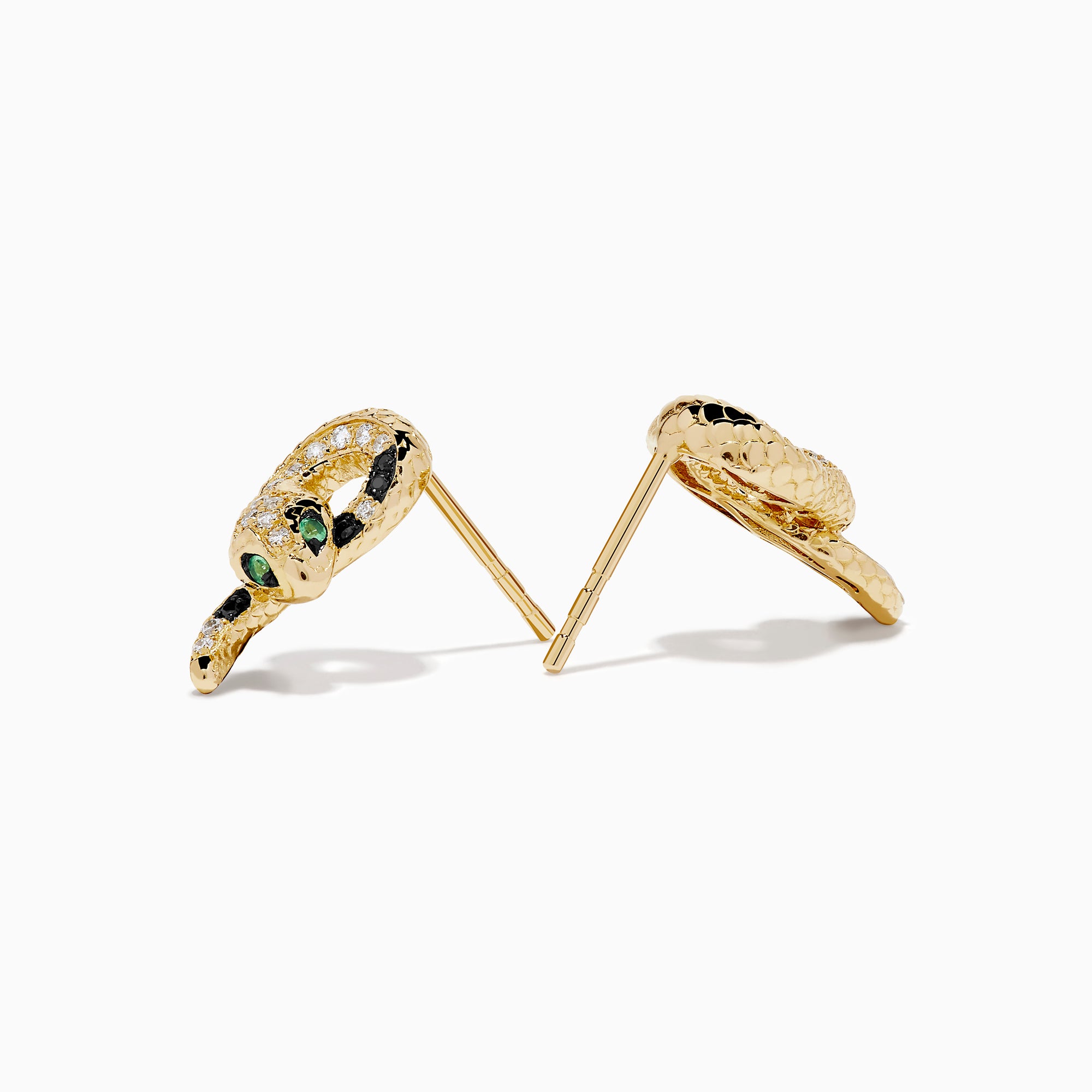The 14K Yellow Gold Black and White Diamond Snake Earrings, featuring green gemstones, are elegantly displayed on a white background.