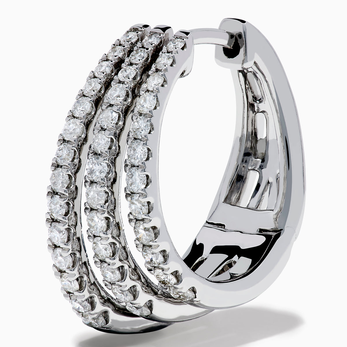 Elegant 14K White Gold Diamond Triple-Band Huggie Hoop Earrings featuring three overlapping curved rows of sparkling diamonds, set against a white background.