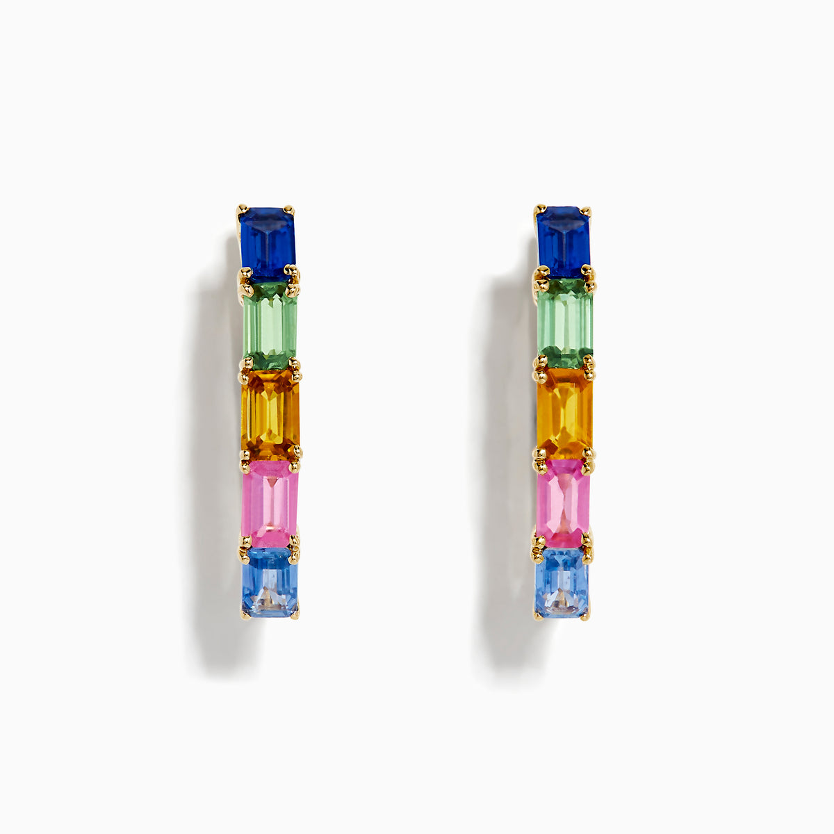 The 14K Yellow Gold Multi Color Sapphire Huggie Earrings feature rectangular sapphires in blue, green, pink, and orange set vertically along each hoop, shown against a white background.