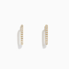 The D'Oro 14K Yellow Gold Diamond Square Huggie Earrings feature a vertical row of sparkling diamonds, beautifully set in gold and photographed on a plain white background.