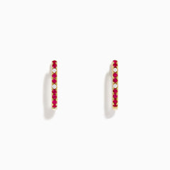 The Ruby Royale 14K Yellow Gold Ruby and Diamond Square Huggie Earrings feature slim bars set with alternating red rubies and clear diamonds, shown against a plain white background.