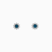 Bella Bleu 14K white gold earrings feature a floral design with blue and white diamonds (0.50 TCW) clustered at the center and clear stones surrounding, shown on a white background.