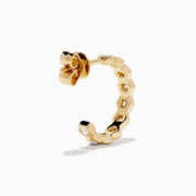 D'Oro 14K Yellow Gold Bezel Set Diamond Mini Hoop Earrings feature round diamonds in bezel settings along the front, alternating with gold, shown on a white background.