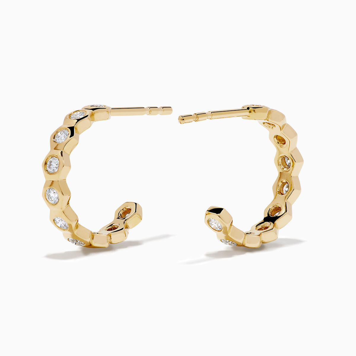 D'Oro 14K Yellow Gold Bezel Set Diamond Mini Hoop Earrings feature round diamonds in bezel settings along the front, alternating with gold, shown on a white background.