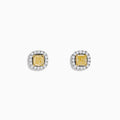The Canare 18K Two Tone Gold Yellow Cushion Yellow and White Diamond Stud Earrings feature cushion cut yellow diamonds, each encircled by a halo of small round white stones, displayed on a plain white background.