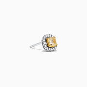 The Canare 18K Two Tone Gold Yellow Cushion Yellow and White Diamond Stud Earrings feature cushion cut yellow diamonds, each encircled by a halo of small round white stones, displayed on a plain white background.