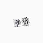 The Canare 18K Two Tone Gold Yellow Cushion Yellow and White Diamond Stud Earrings feature cushion cut yellow diamonds, each encircled by a halo of small round white stones, displayed on a plain white background.