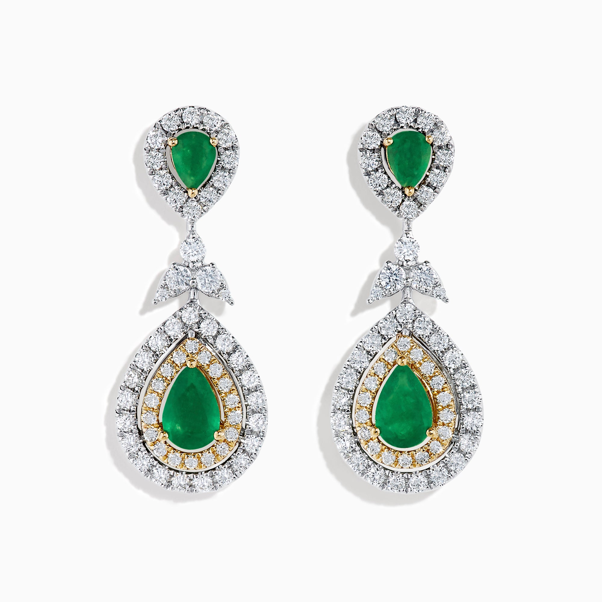 Chic 14K two tone gold statement earrings featuring double pear emeralds, concentric rows of white and yellow diamonds, and a delicate diamond bow—elegant emerald and diamond earrings for any occasion.