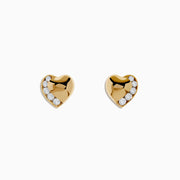 The DOro 14K Yellow Gold Diamond Heart Stud Earrings feature a curved row of small, round white diamonds on one side, shown on a plain white background.
