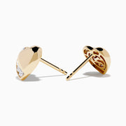 The DOro 14K Yellow Gold Diamond Heart Stud Earrings feature a curved row of small, round white diamonds on one side, shown on a plain white background.