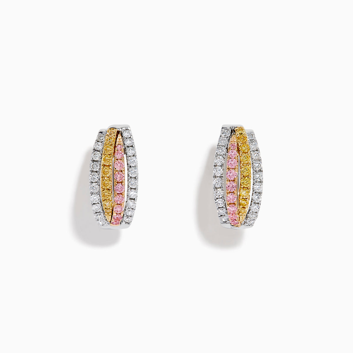 The 18K 3-Tone Gold White, Yellow and Pink Diamond Huggie Earrings feature three rows of diamonds set in white, yellow, and pink gold, showcased in a curved, oval-shaped design against a white background.
