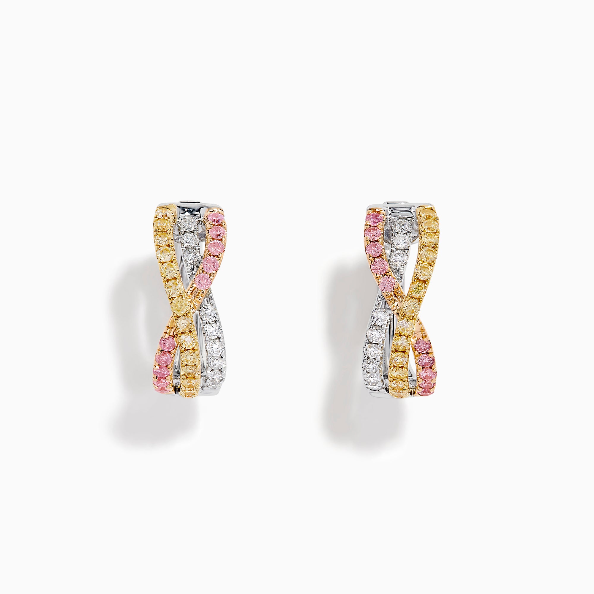 The 18K 3-Tone Gold White, Pink, and Yellow Diamond Huggie Earrings feature intertwined bands of diamonds in a crossover design, set against a white background.