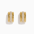 The D'Oro 14K Yellow Gold Pave Diamond Chunky Huggie Earrings feature three rows of sparkling white diamonds set in the center and bordered by polished gold segments.