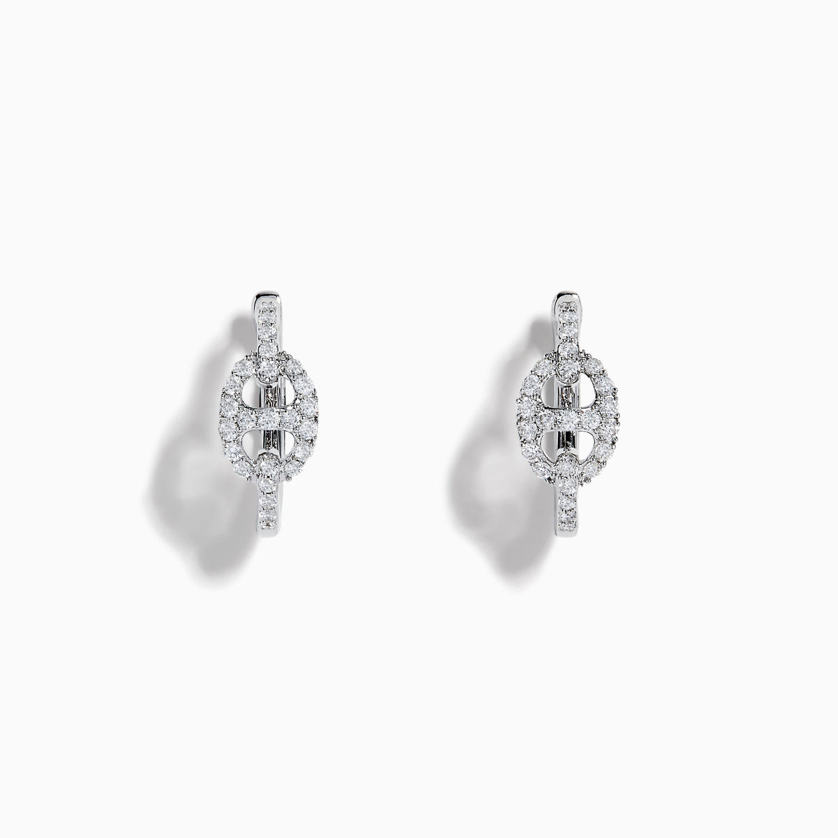 14K White Gold Diamond Link Mini Hoop Earrings featuring baguette and round-cut diamonds in an oval design, displayed against a plain white background.