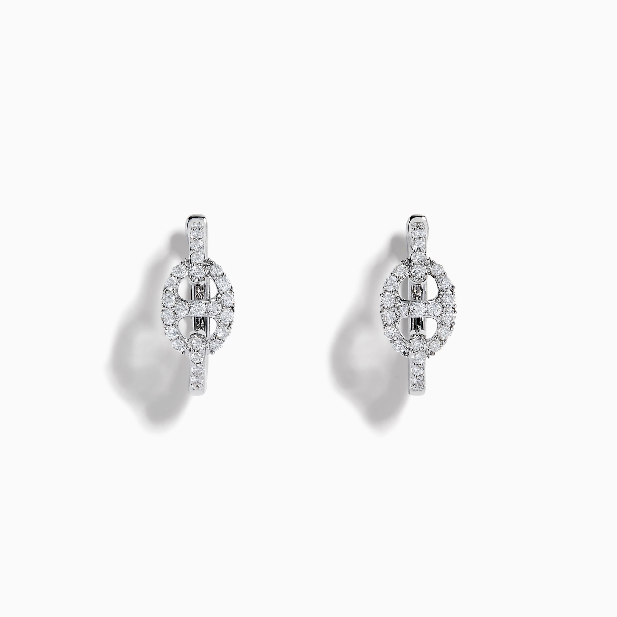 14K White Gold Diamond Link Mini Hoop Earrings featuring baguette and round-cut diamonds in an oval design, displayed against a plain white background.