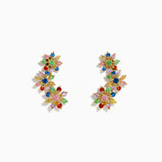 The Watercolors 14K Yellow Gold Multi Sapphire and Tsavorite Floral Ear Climber Stud Earrings feature colorful gemstone clusters in a vibrant floral design, showcased against a white background.