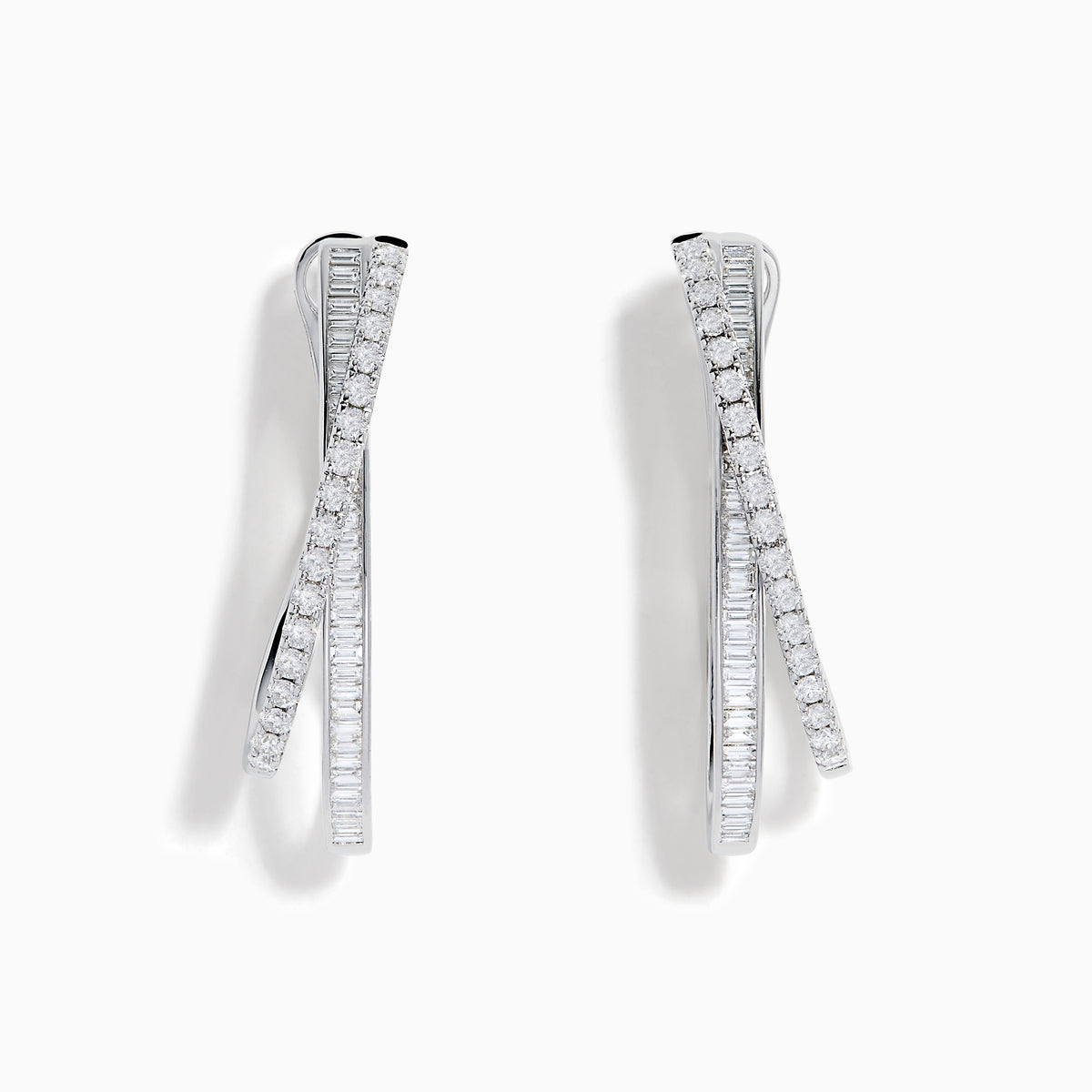 A pair of 14K White Gold Diamond Crossover Hoop Earrings featuring two intertwined, diamond-encrusted lines on each hoop, displayed against a plain white background.
