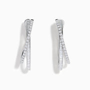 A pair of 14K White Gold Diamond Crossover Hoop Earrings featuring two intertwined, diamond-encrusted lines on each hoop, displayed against a plain white background.