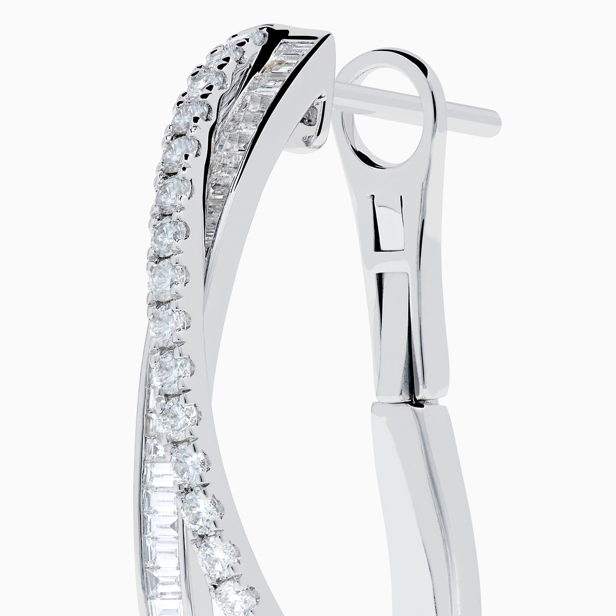 A pair of 14K White Gold Diamond Crossover Hoop Earrings featuring two intertwined, diamond-encrusted lines on each hoop, displayed against a plain white background.