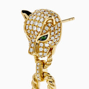 The Signature 14K Yellow Gold Diamond and Emerald Panther Drop Earrings feature panther heads with diamond detailing, emerald eyes, and each holds a gold chain loop in its mouth.