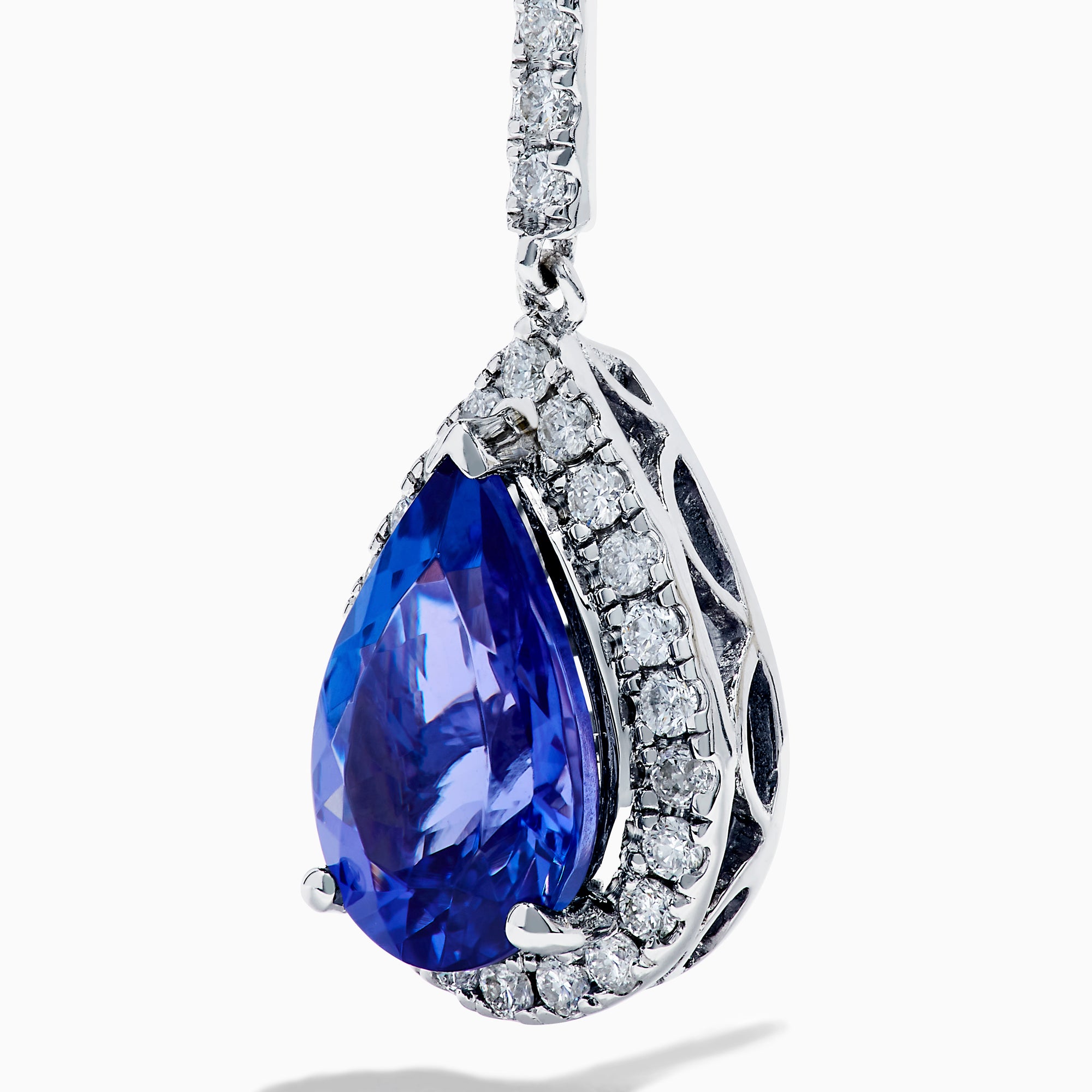 The Nahla 14K White Gold Tanzanite and Diamond Dangle Earrings feature pear-shaped blue Tanzanite gems encircled by diamonds, with a diamond-accented row extending up to the hooks for added elegance.