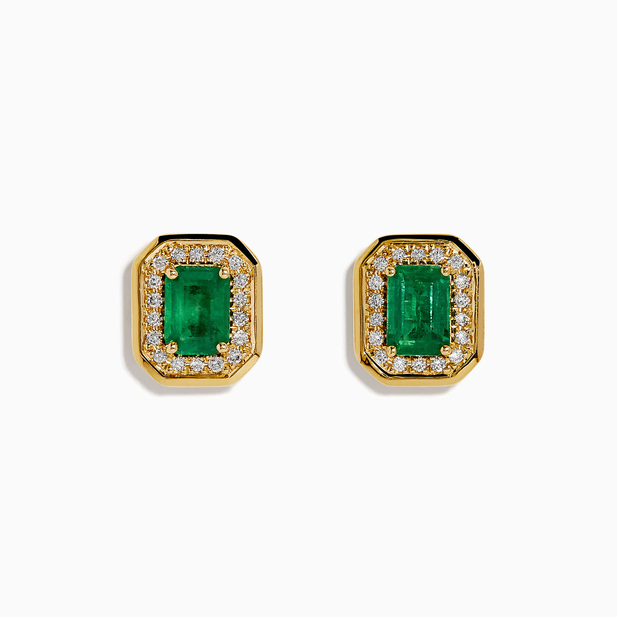 The 14K Yellow Gold Emerald and Diamond Halo Stud Earrings feature rectangular emerald-green stones surrounded by a sparkling diamond halo, set in yellow gold and shown against a white background.