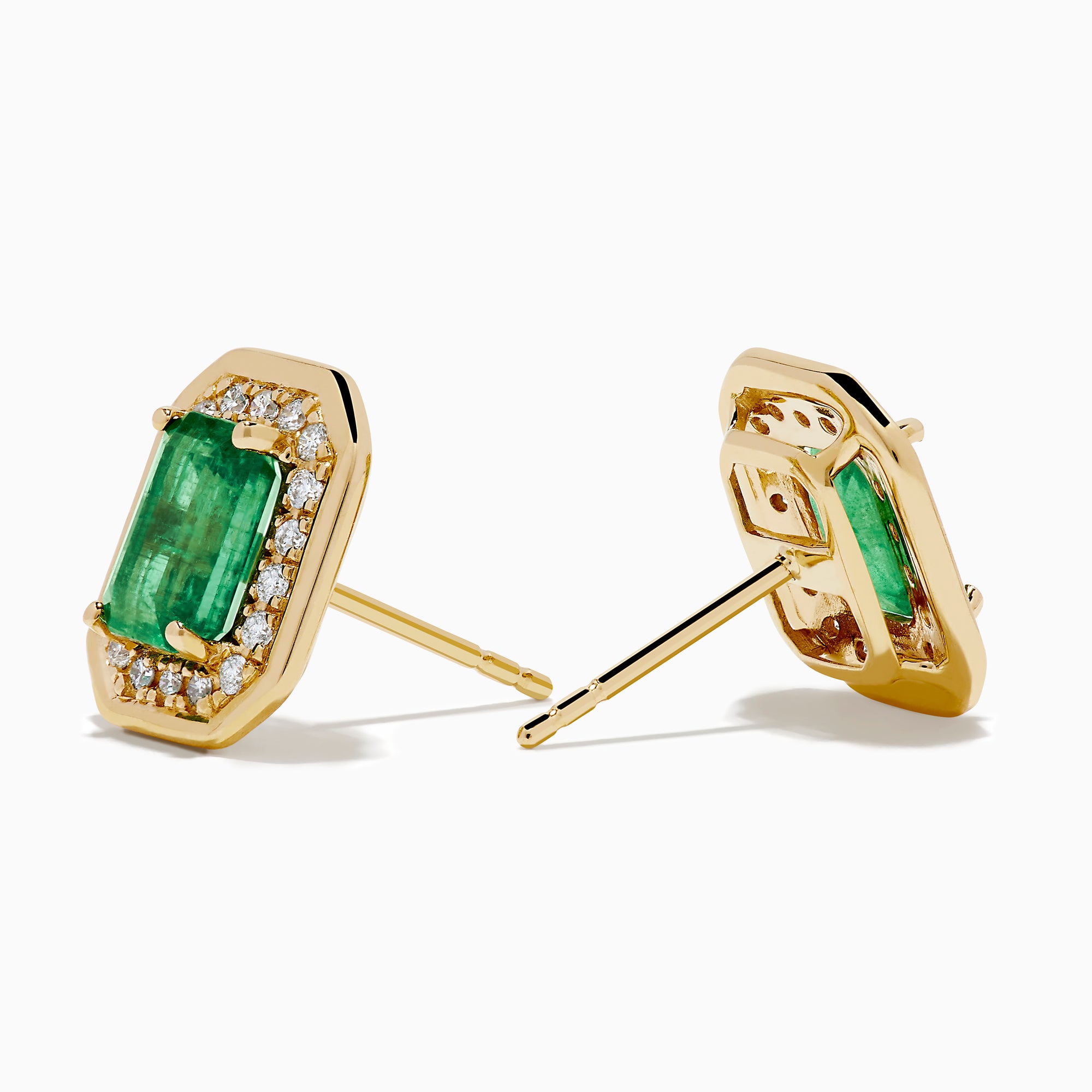 The 14K Yellow Gold Emerald and Diamond Halo Stud Earrings feature rectangular emerald-green stones surrounded by a sparkling diamond halo, set in yellow gold and shown against a white background.